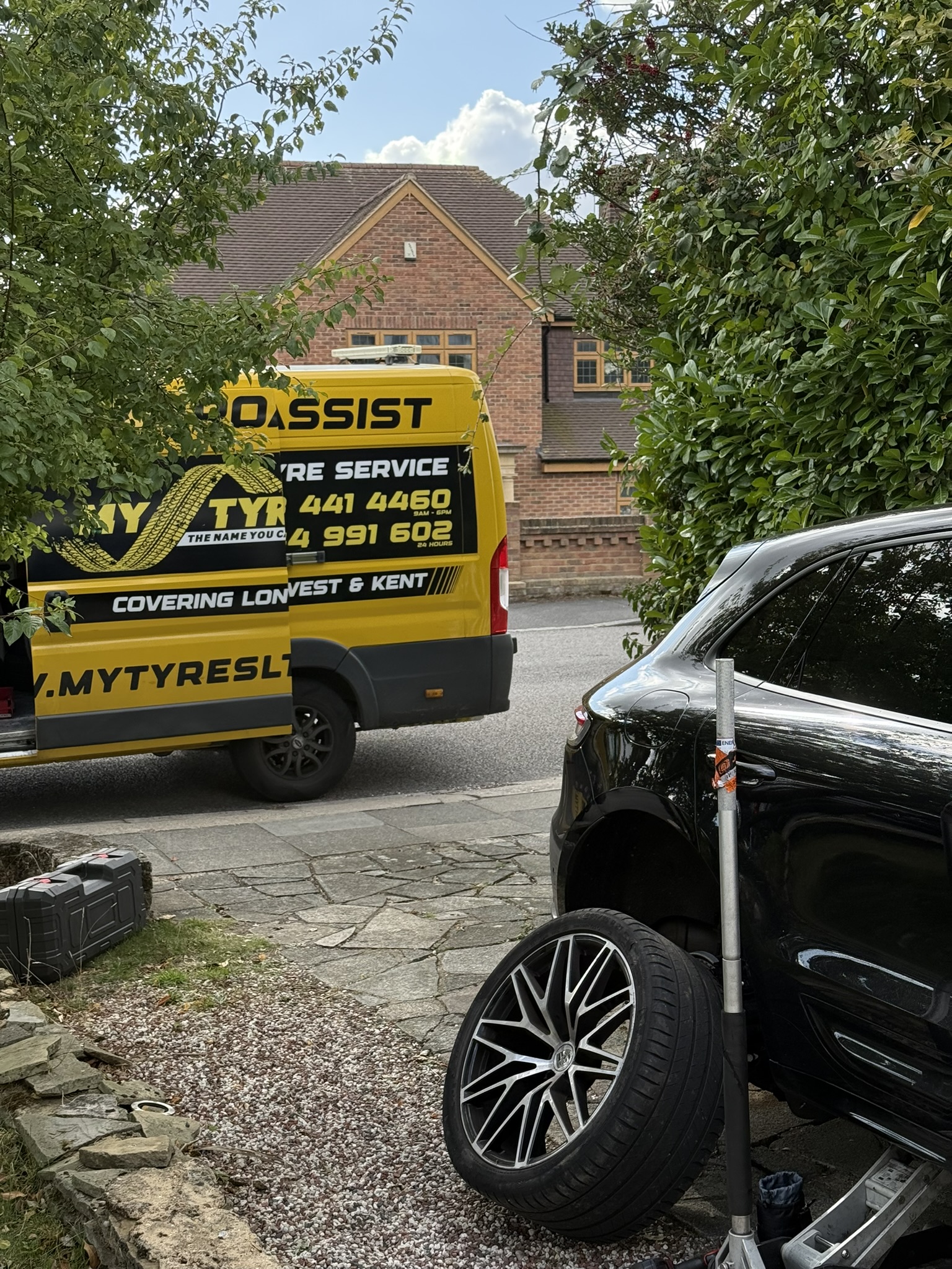 Flat tyre repair in progress in Peckham